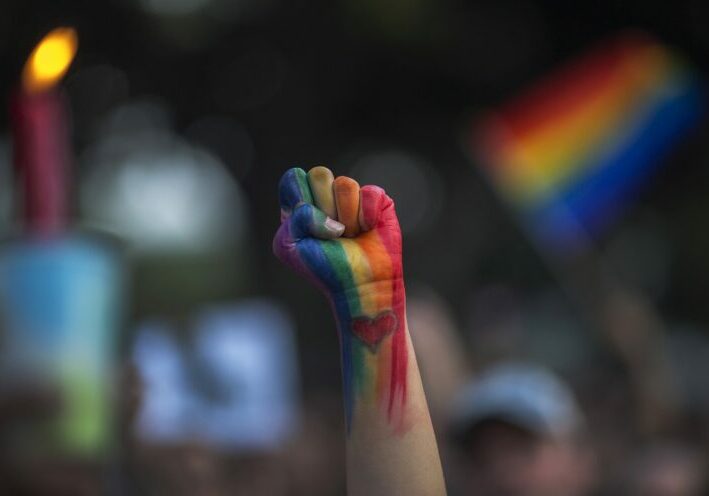 LOS ANGELES, CA - JUNE 13: A defiant fist is raised at a vigil for the worst mass shooing in United States history on June 13, 2016 in Los Angeles, United States. A gunman killed 49 people and wounded 53 others at a gay nightclub in Orlando, Florida early yesterday morning before suspect Omar Mateen also died on-scene.  (Photo by David McNew/Getty Images)