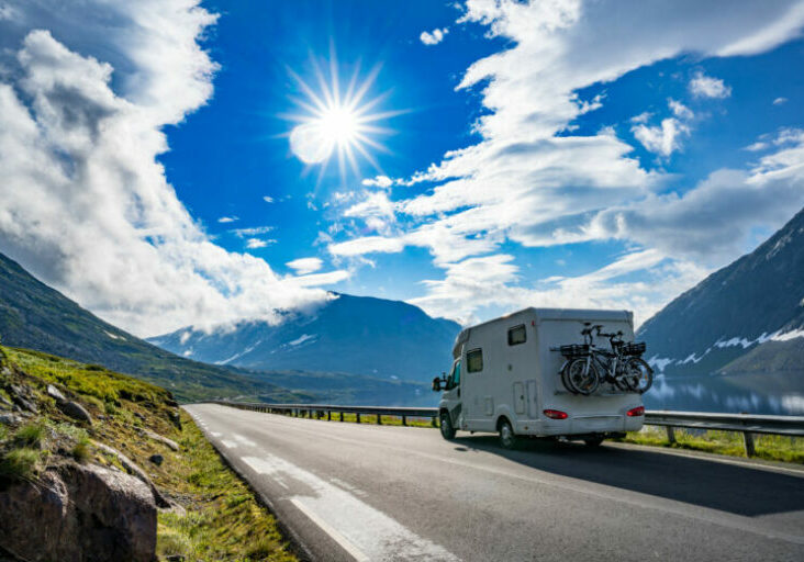 Family vacation travel RV, holiday trip in motorhome, Caravan car Vacation. Beautiful Nature Norway natural landscape.