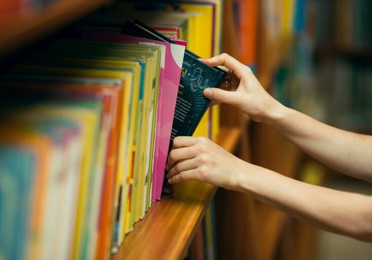 student-searching-books-library